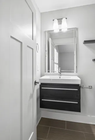 a bathroom with a vanity and a mirror
