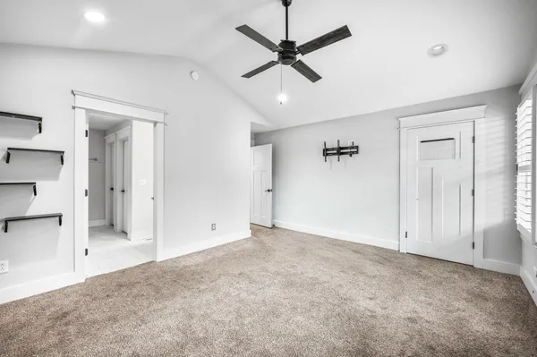 a view of livingroom with a ceiling fan and window