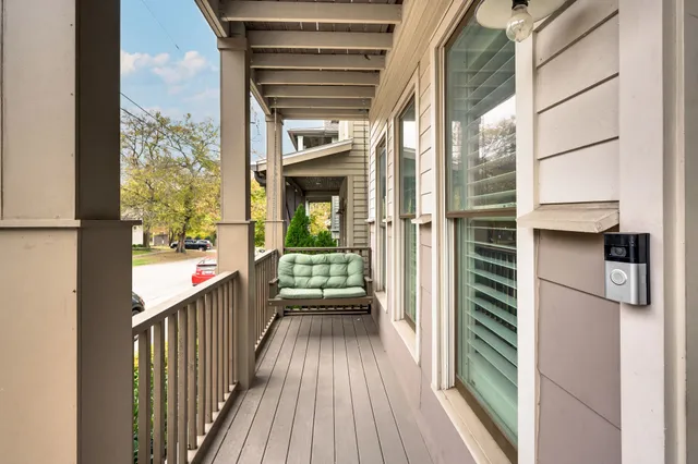 a view of a balcony with wooden floor