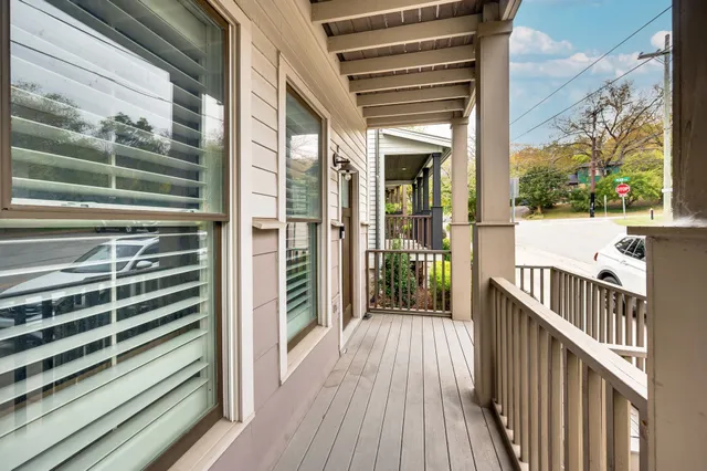 a view of a balcony with wooden floor