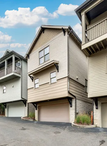 a front view of a house with a garage