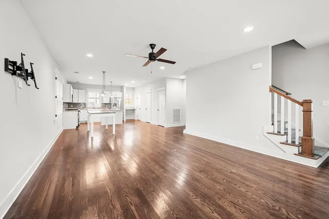a view of kitchen with furniture and wooden floor