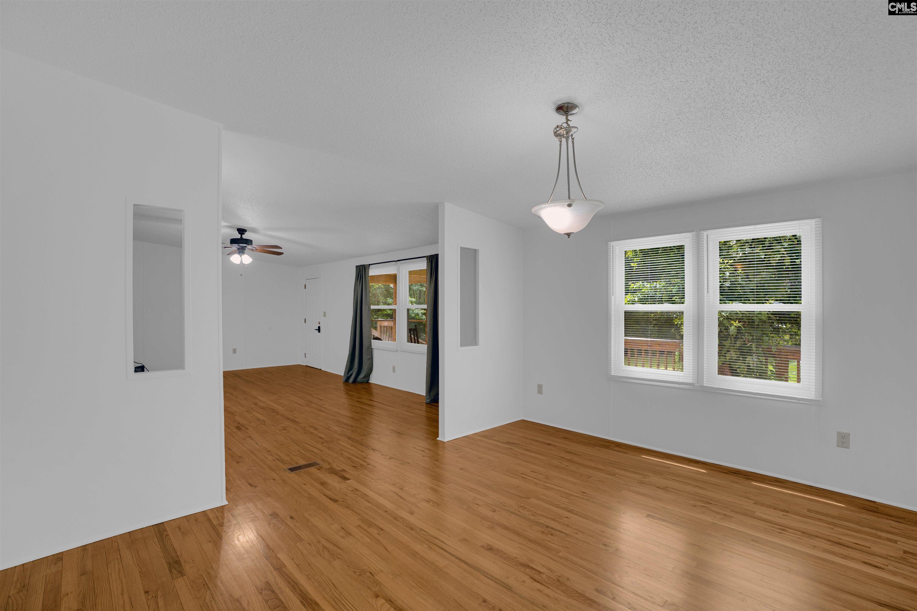 304 Cooper Road Blythewood, SC 29016 - Photo 12 of 29 a view of empty room with wooden floor and fan
