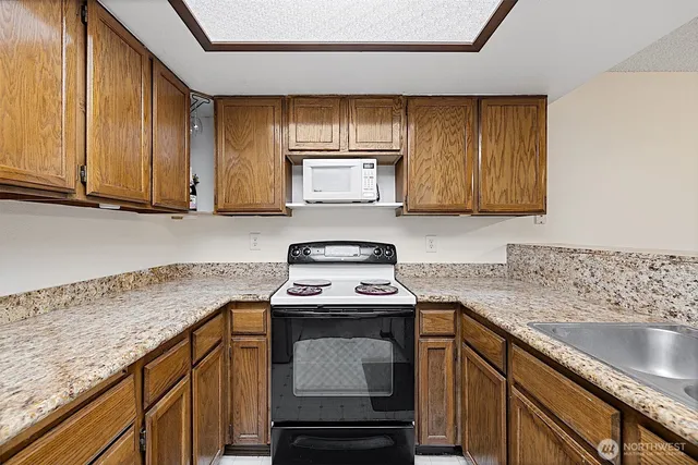a white refrigerator freezer sitting inside of a kitchen