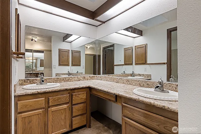 a view of an empty room with a fan