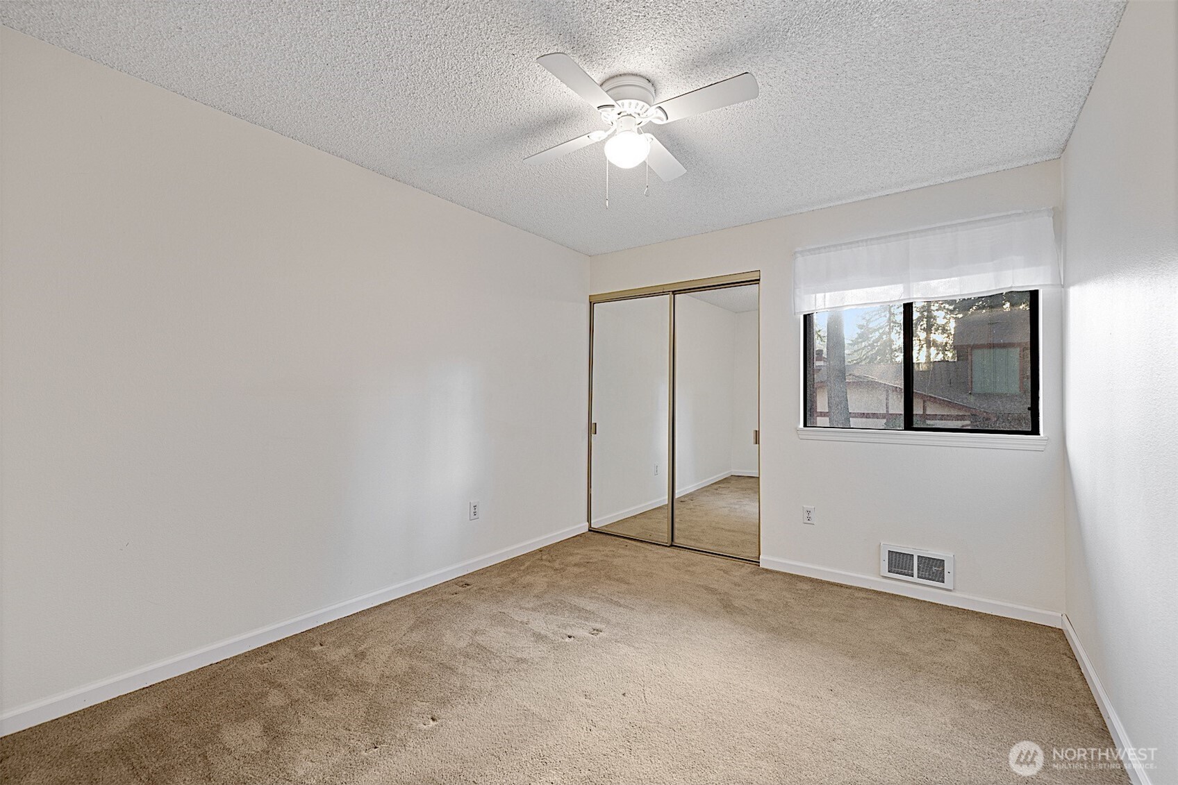 4724 Southwest 317th Lane, Unit B Federal Way, WA 98023 - Photo 27 of 40 a view of an empty room with a fan