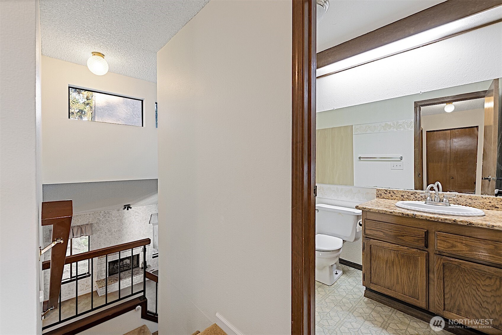 4724 Southwest 317th Lane, Unit B Federal Way, WA 98023 - Photo 29 of 40 a bathroom with a sink and a mirror