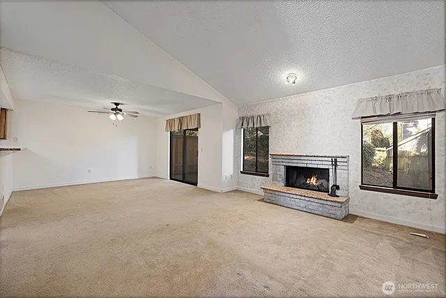 a living room with furniture potted plant and a chandelier