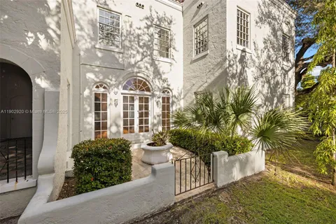 a view of a livingroom with a ceiling fan wooden floor and window