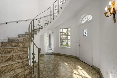 a view of empty room with fireplace