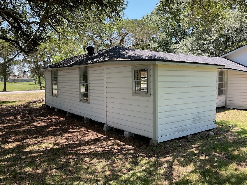 1329 Adams Road Bay City, TX 77414 - Photo 14 of 14 a view of a small house with a yard