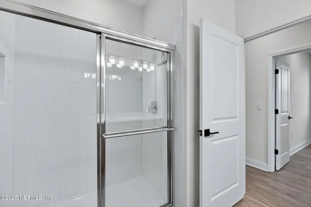 an aerial view of residential houses with outdoor space and swimming pool