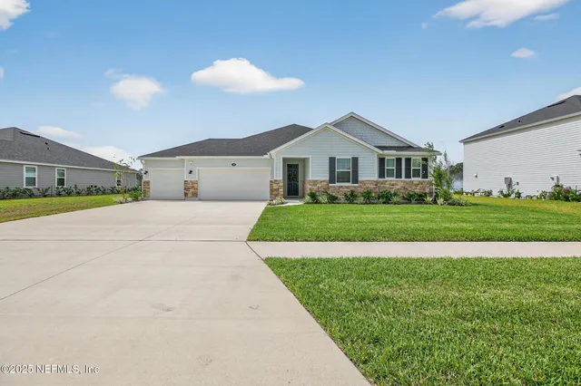 a view of yard with swimming pool and trees