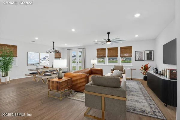a view of a hallway with wooden floor and plant