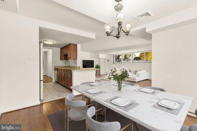 a view of a dining room with furniture and wooden floor
