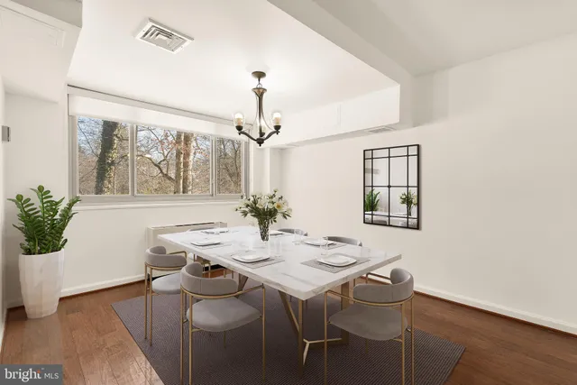 a view of a dining room with furniture and window