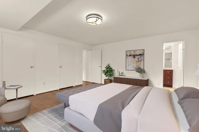 a bedroom with a bed and a table