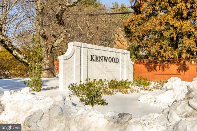 a street sign on a sidewalk next to a road
