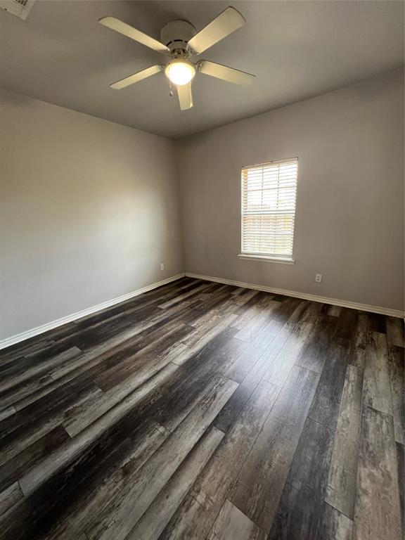 906 Parkplace Ridge Princeton, TX 75407 - Photo 20 of 25 Wood-finish flooring with baseboard trim