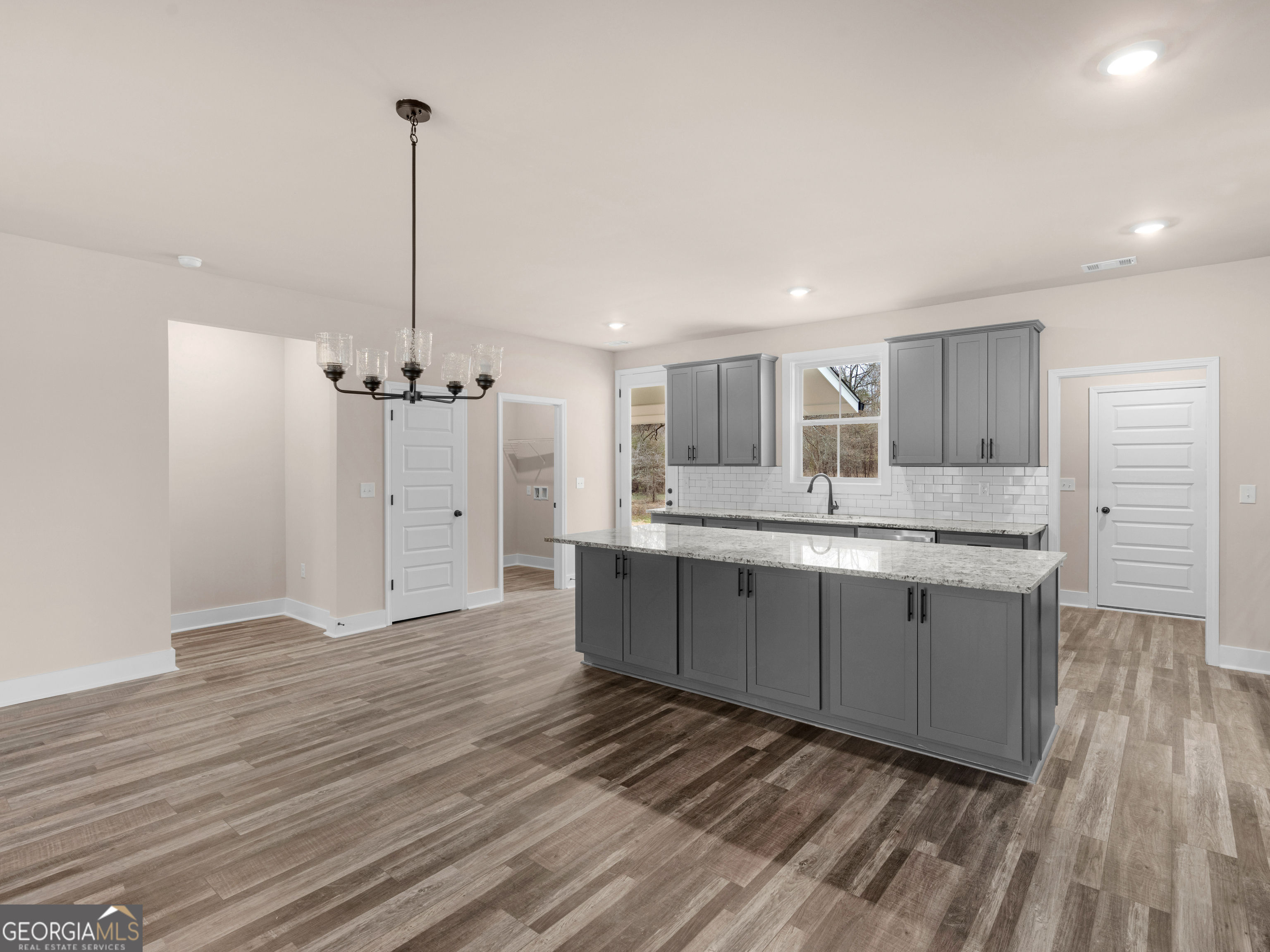 160 Loyd Road Mansfield, GA 30056 - Photo 19 of 53 a large kitchen with a lot of counter space and wooden floor