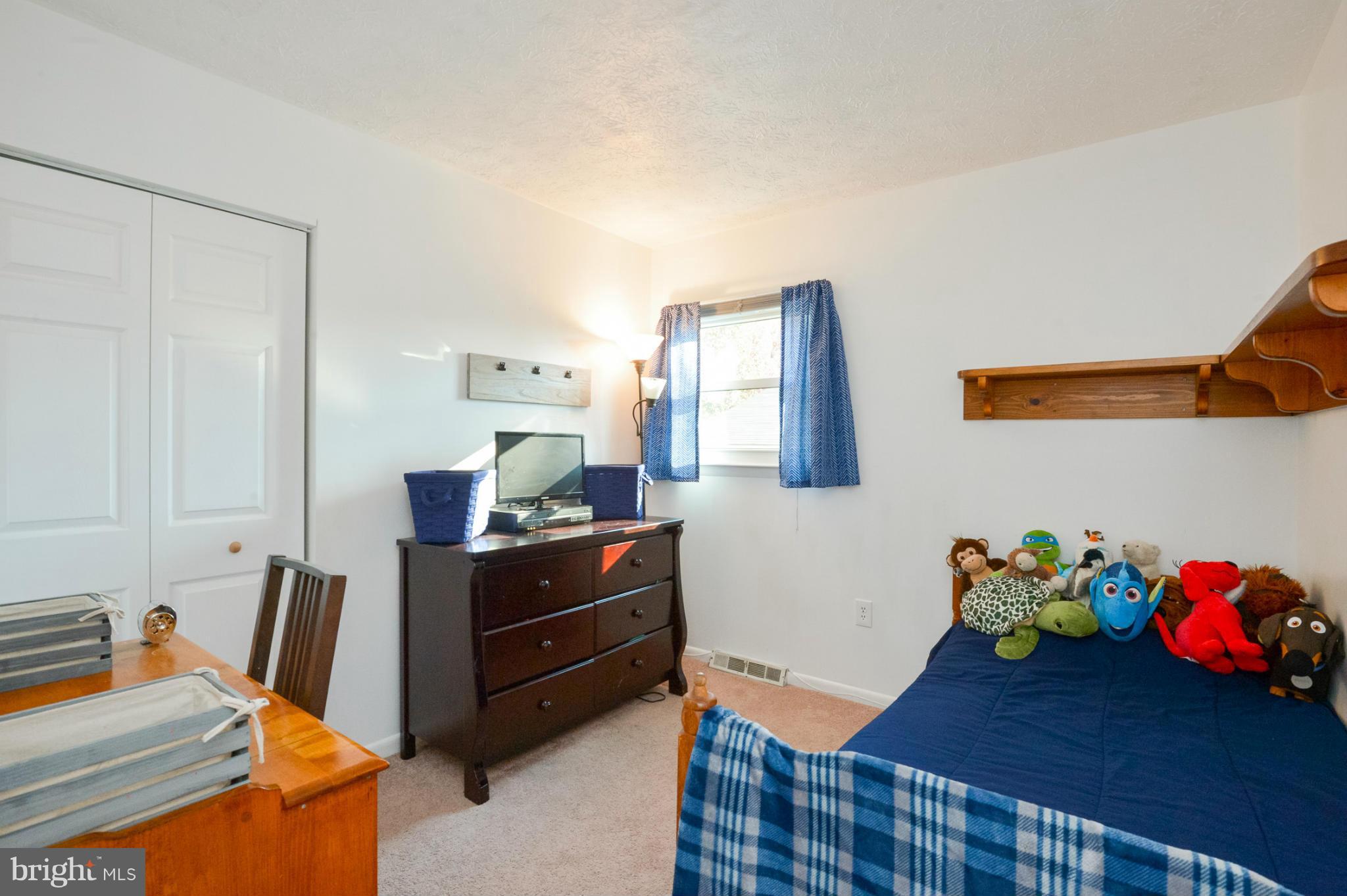 1927 Grant Road Halethorpe, MD 21227 - Photo 21 of 29 a bedroom with a bed and a dresser in it