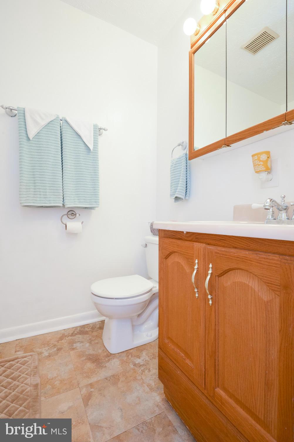 1927 Grant Road Halethorpe, MD 21227 - Photo 23 of 29 a bathroom with a toilet a sink and mirror