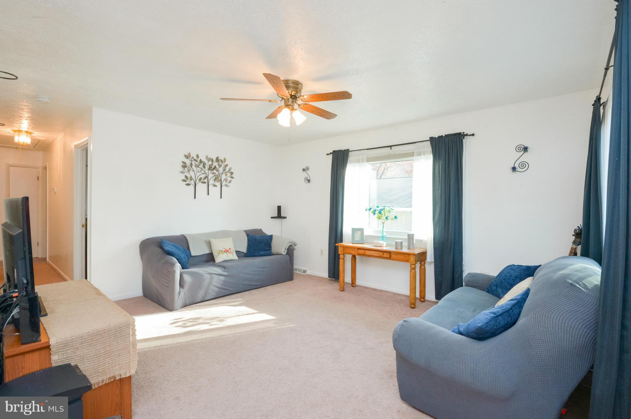1927 Grant Road Halethorpe, MD 21227 - Photo 7 of 29 a living room with furniture and a flat screen tv