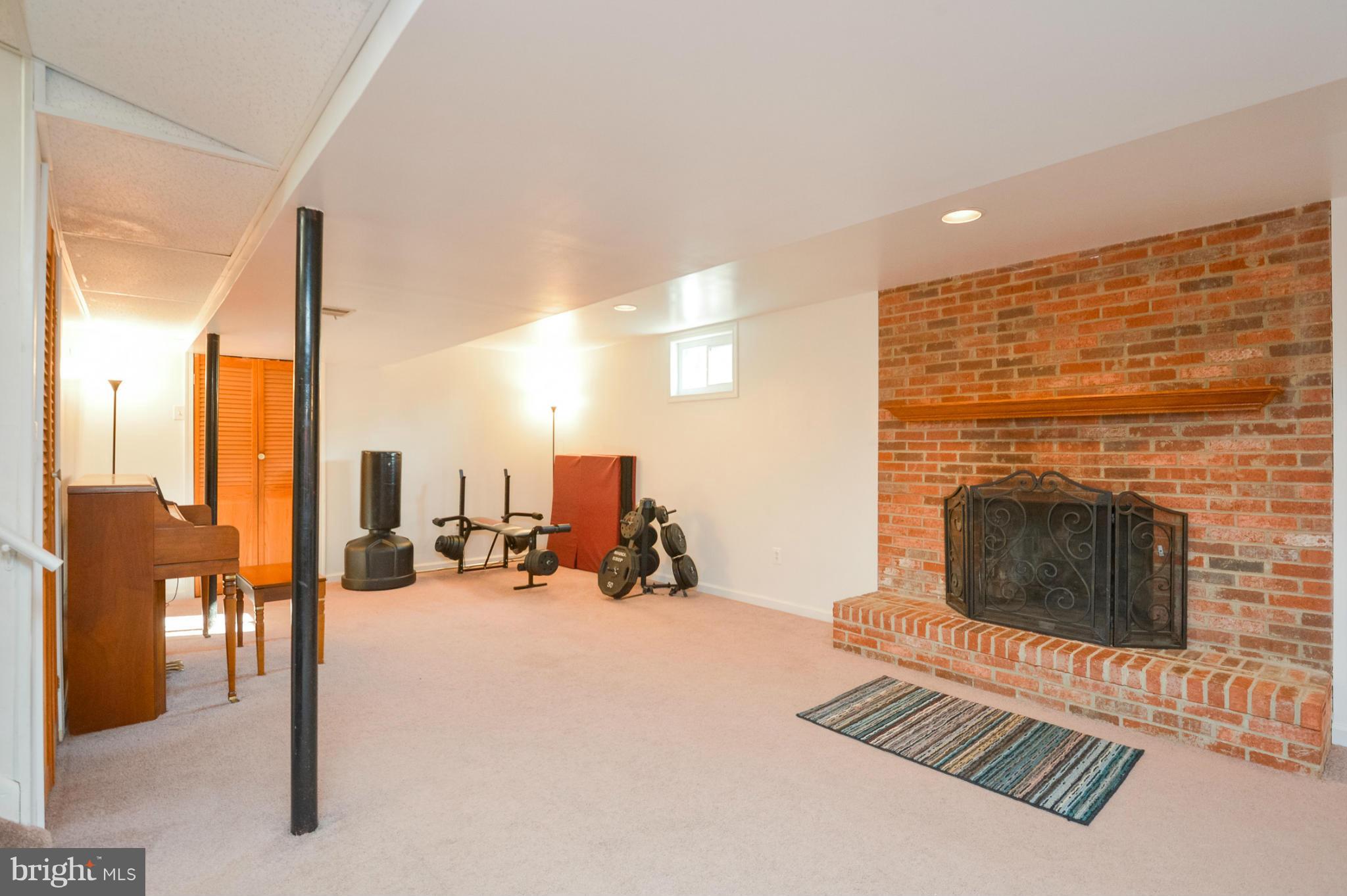 1927 Grant Road Halethorpe, MD 21227 - Photo 10 of 29 a living room with furniture and a fireplace