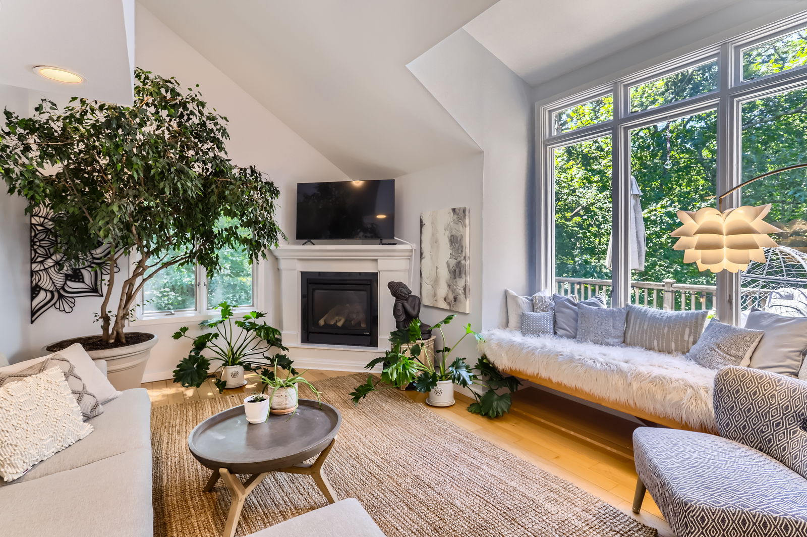 3 Fulling Mill Road Chilmark, MA 02535 - Photo 17 of 48 a living room with furniture a large window and a fireplace