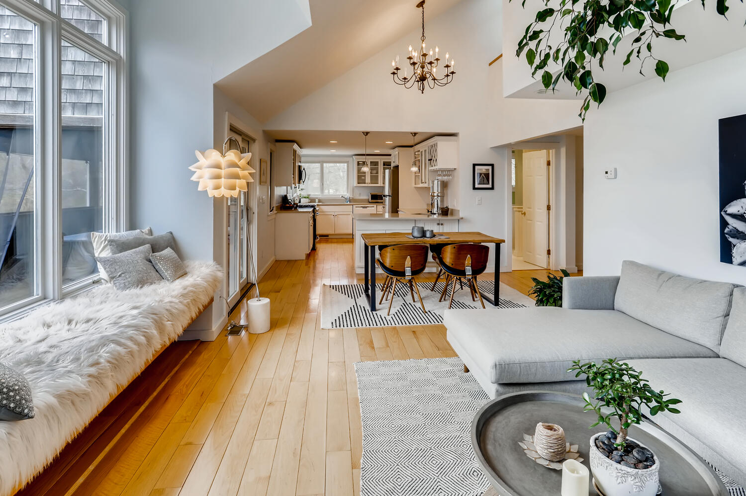 3 Fulling Mill Road Chilmark, MA 02535 - Photo 19 of 48 a living room with furniture and a chandelier
