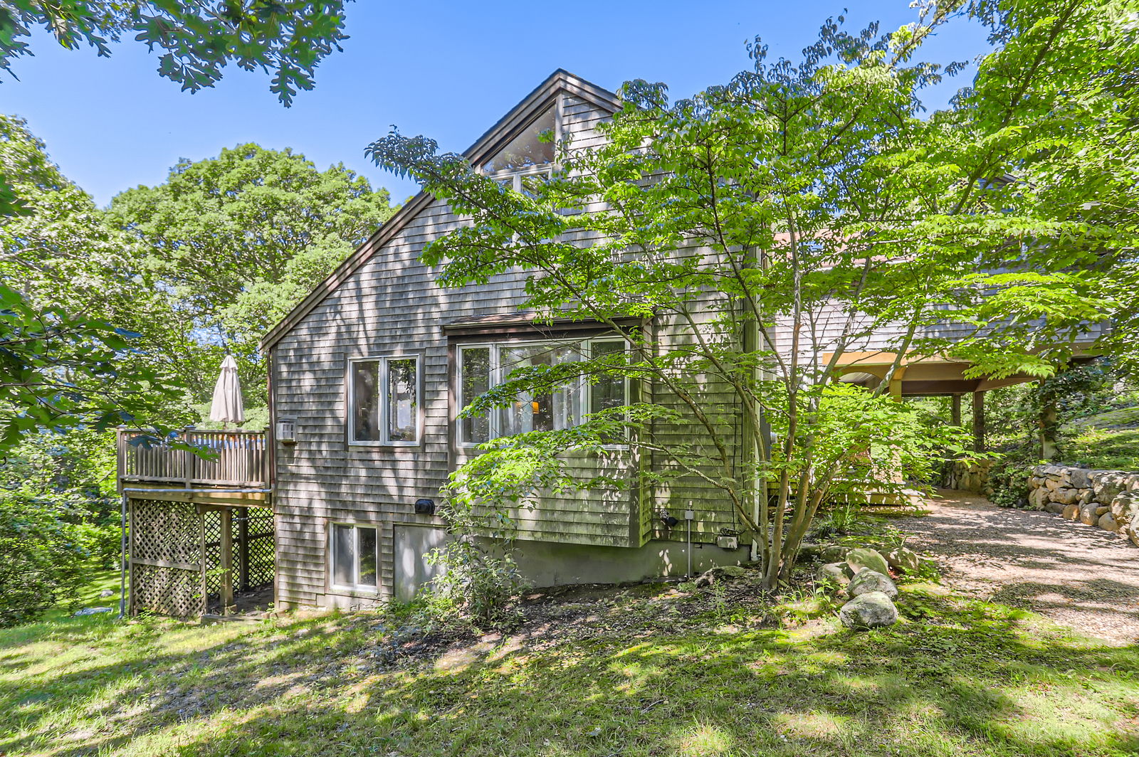 3 Fulling Mill Road Chilmark, MA 02535 - Photo 4 of 48 a backyard of a house with lots of green space