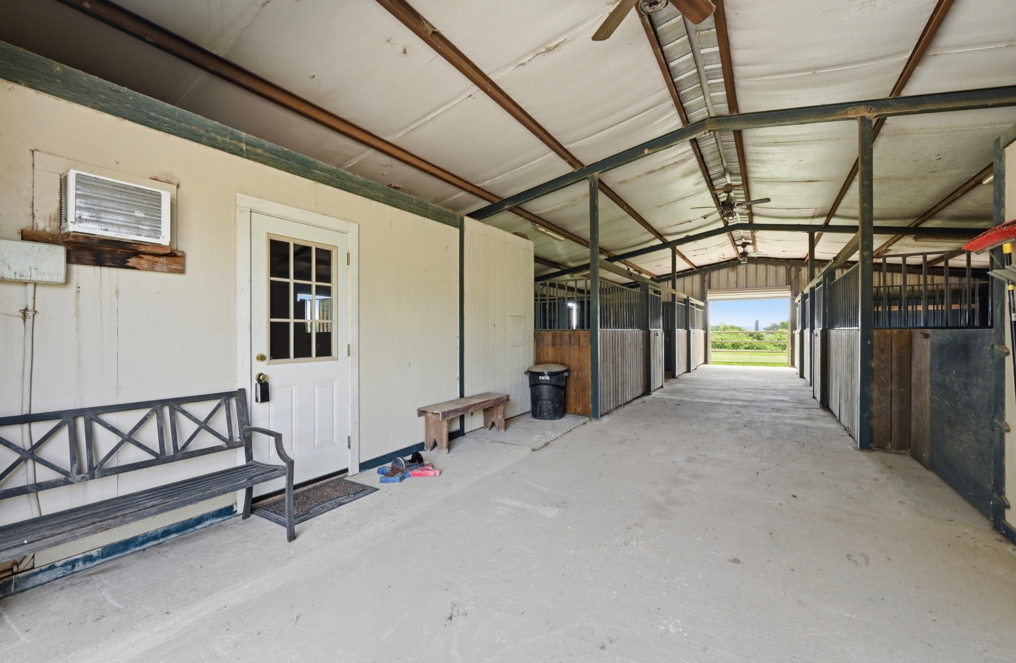 1175 Southern Way Luling, TX 78648 - Photo 9 of 40 A well-ventilated stable offers comfortable stalls and easy outdoor access to expansive grounds.