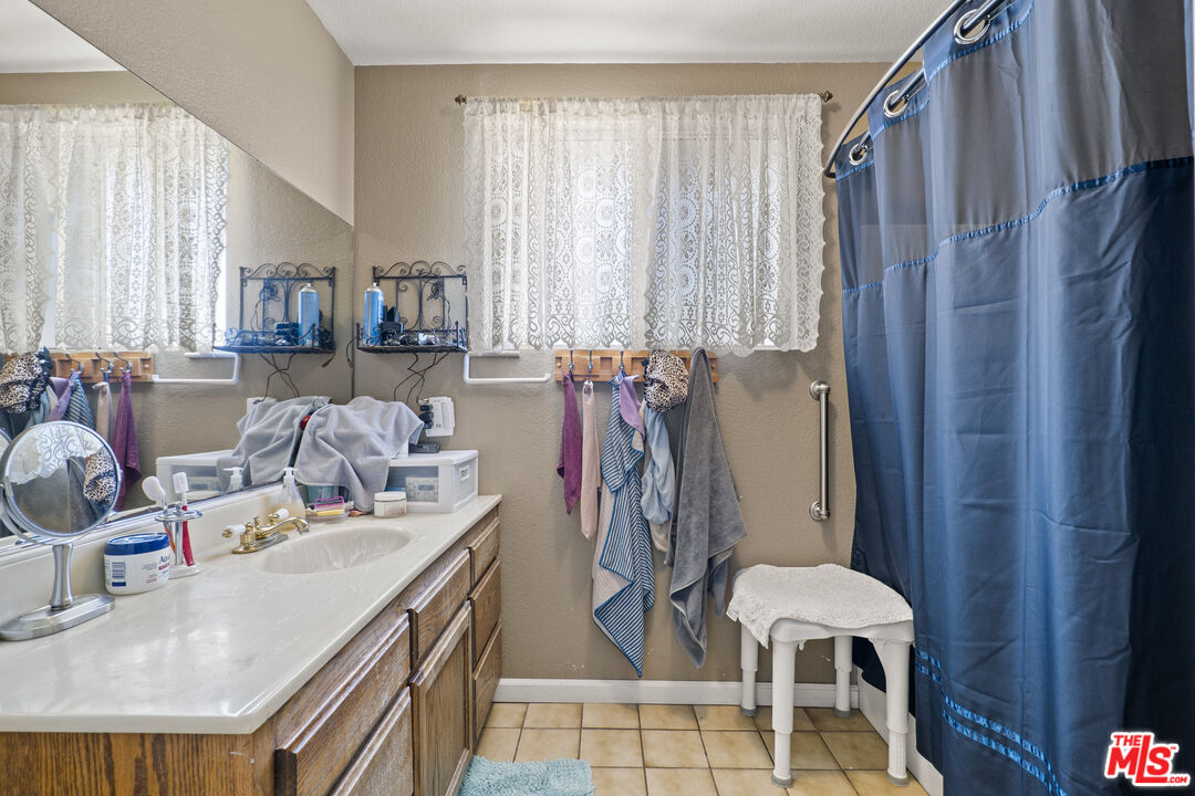 10647 East Ave R 10 Littlerock, CA 93543 - Photo 16 of 34 a dining room with furniture and a window