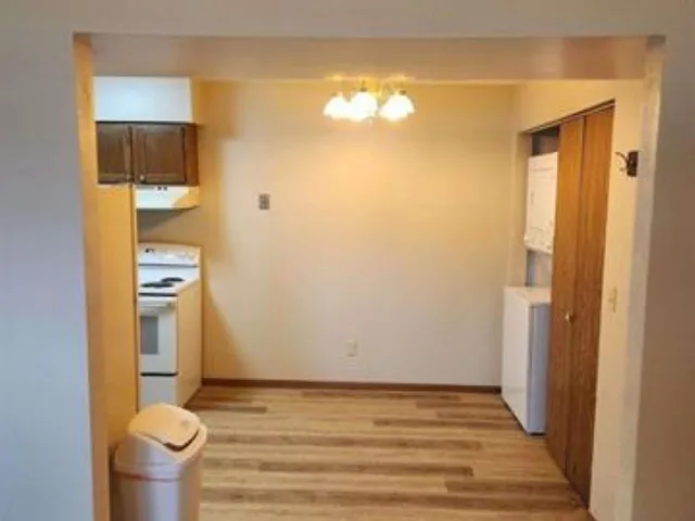 a kitchen with a sink cabinets and stainless steel appliances