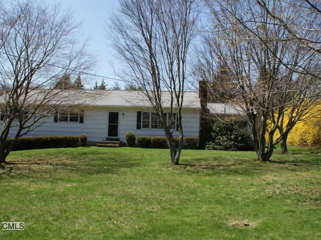 a view of a house with a backyard