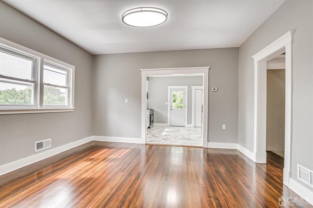 48 Johnson Place South River, NJ 08882 - Photo 11 of 34 wooden floor in an empty room with a window