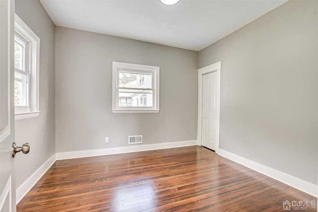 48 Johnson Place South River, NJ 08882 - Photo 18 of 34 wooden floor in an empty room with a window