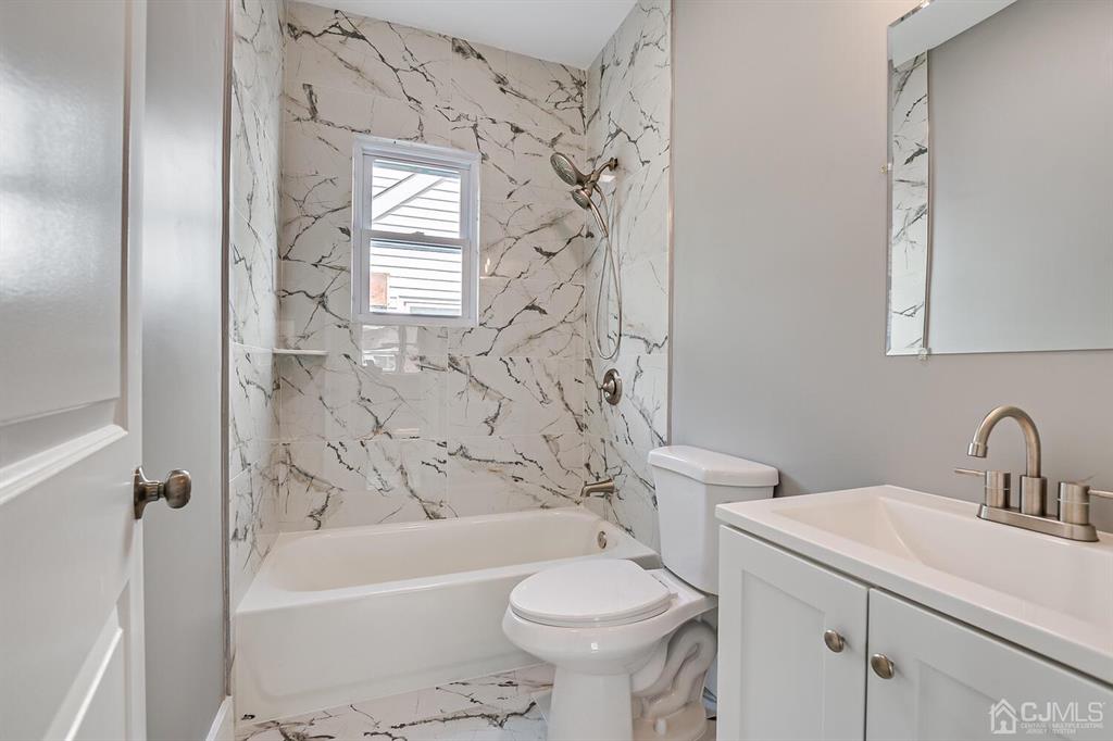 48 Johnson Place South River, NJ 08882 - Photo 20 of 34 a bathroom with a sink toilet and shower