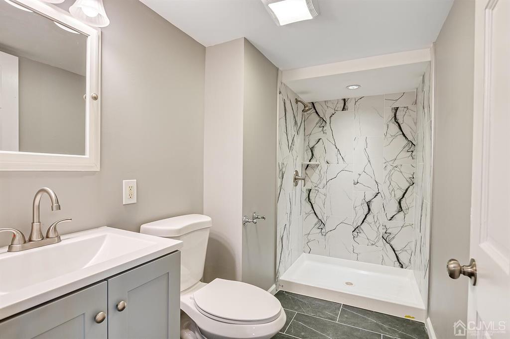 48 Johnson Place South River, NJ 08882 - Photo 30 of 34 a bathroom with a sink toilet and shower