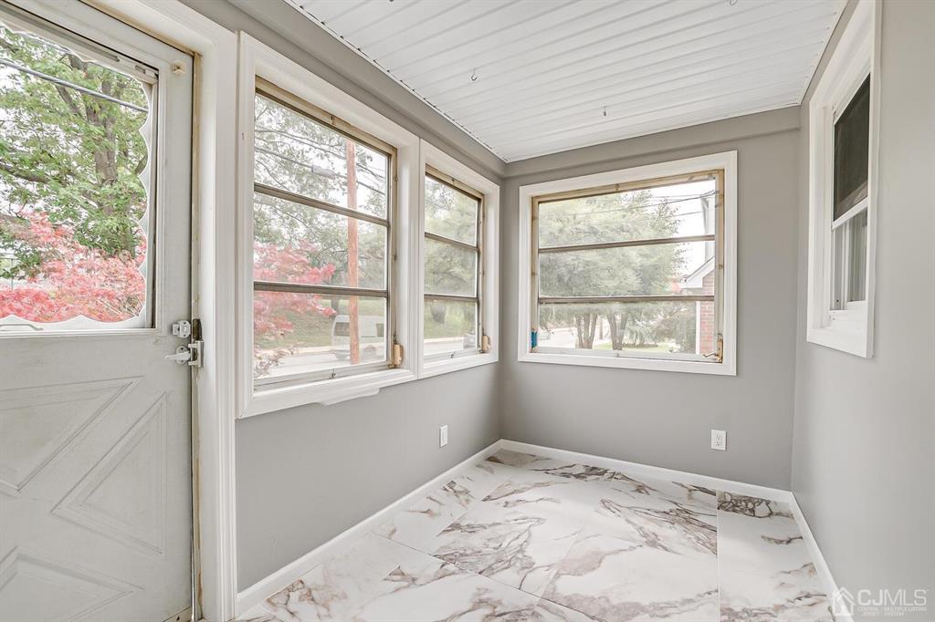 48 Johnson Place South River, NJ 08882 - Photo 5 of 34 an empty room with a large window