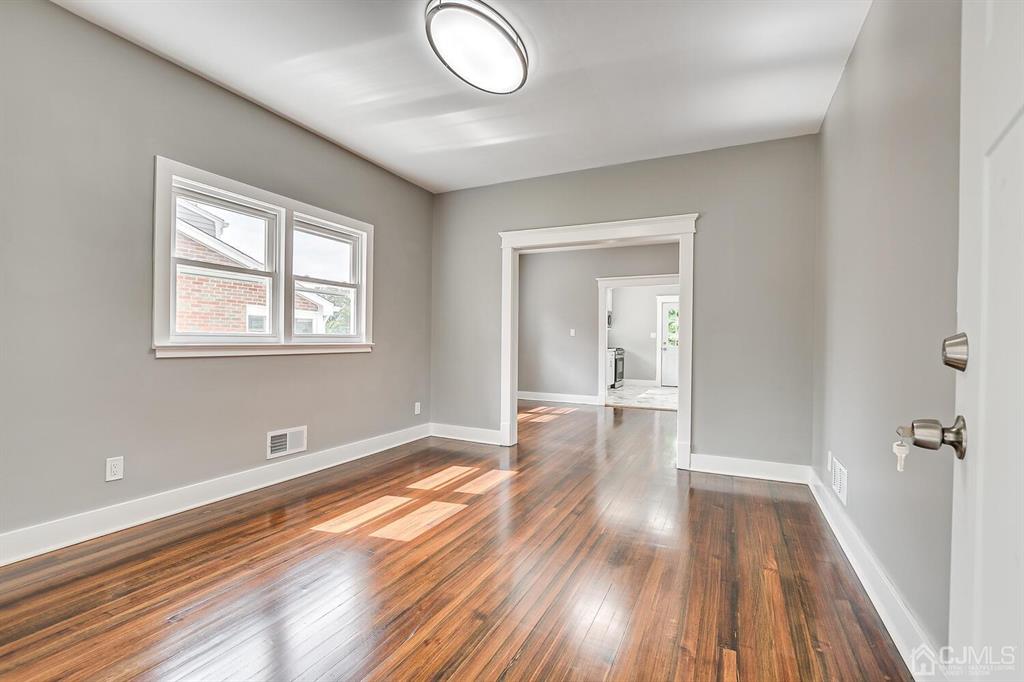 48 Johnson Place South River, NJ 08882 - Photo 6 of 34 a view of livingroom with hardwood floor and window