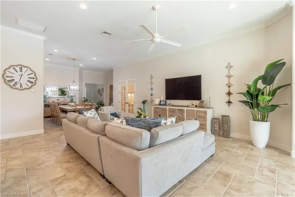 a living room with fireplace furniture and a flat screen tv