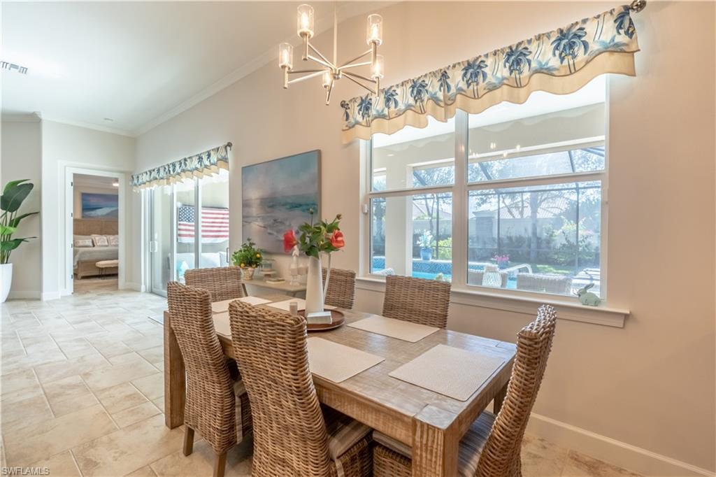 9332 Fieldstone Lane Naples, FL 34120 - Photo 15 of 41 a view of a dining room with furniture window and outside view
