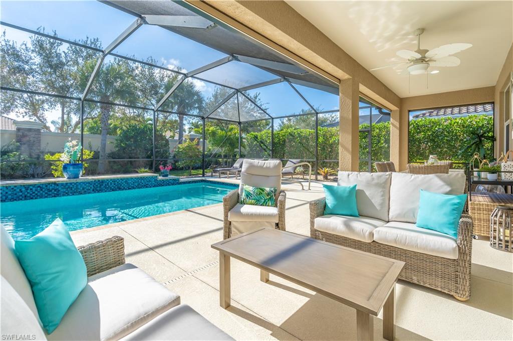 9332 Fieldstone Lane Naples, FL 34120 - Photo 2 of 41 a view of a patio with swimming pool