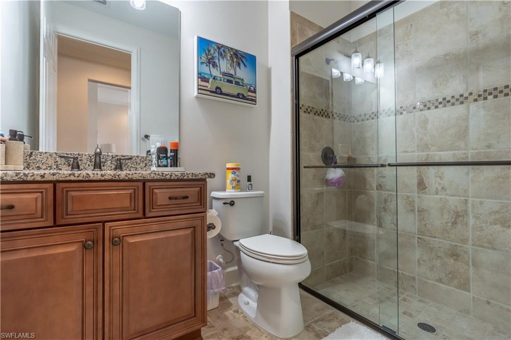 9332 Fieldstone Lane Naples, FL 34120 - Photo 23 of 41 a bathroom with a sink toilet and shower