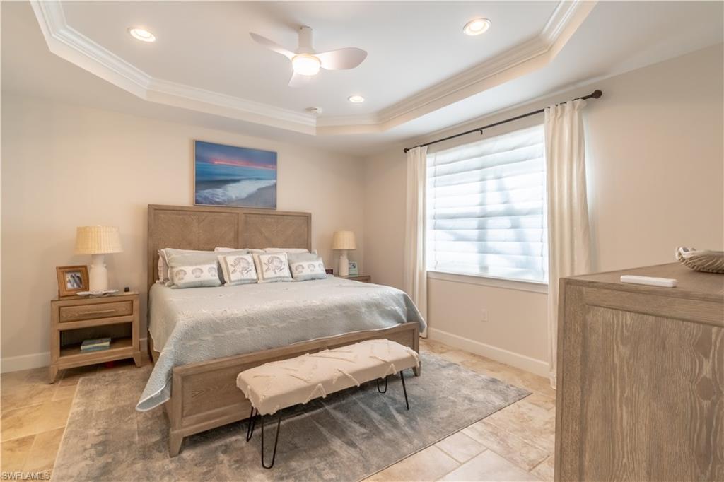 9332 Fieldstone Lane Naples, FL 34120 - Photo 24 of 41 a bedroom with a bed and a window