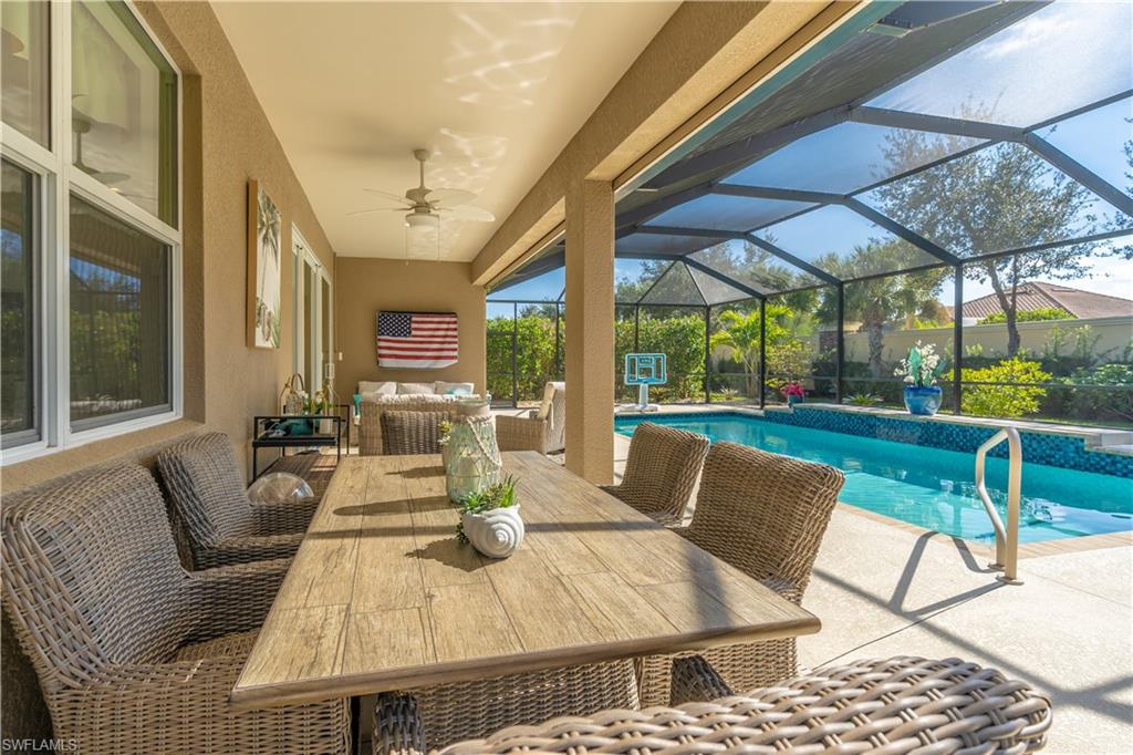9332 Fieldstone Lane Naples, FL 34120 - Photo 32 of 41 a view of an outdoor dining space with furniture