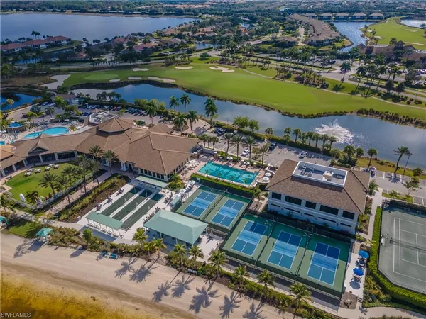 an aerial view of a house with a lake view