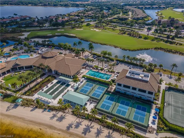 an aerial view of a house with a lake view