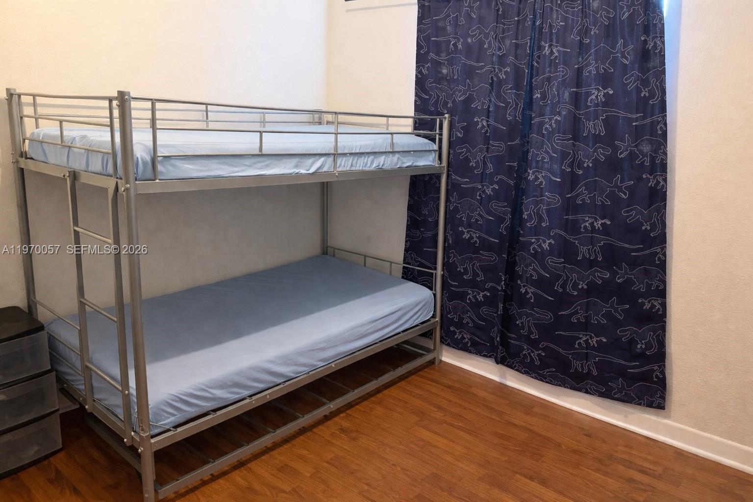 1485 Northeast 33rd Road, Unit 207 Homestead, FL 33033 - Photo 5 of 10 a view of a balcony with wooden floor